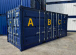 20-fots sjøcontainer "Open Side" med oppsamlingskar
